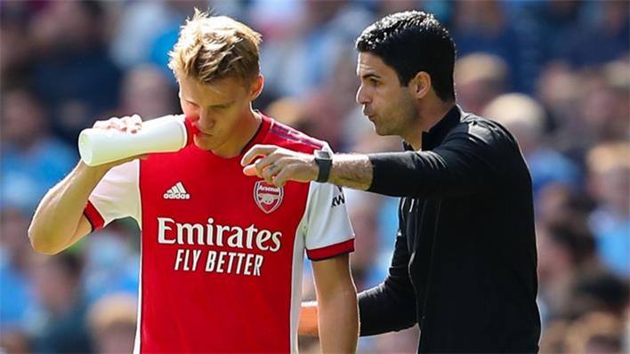 Martin Odegaard talks with Arsenal boss Mikel Arteta